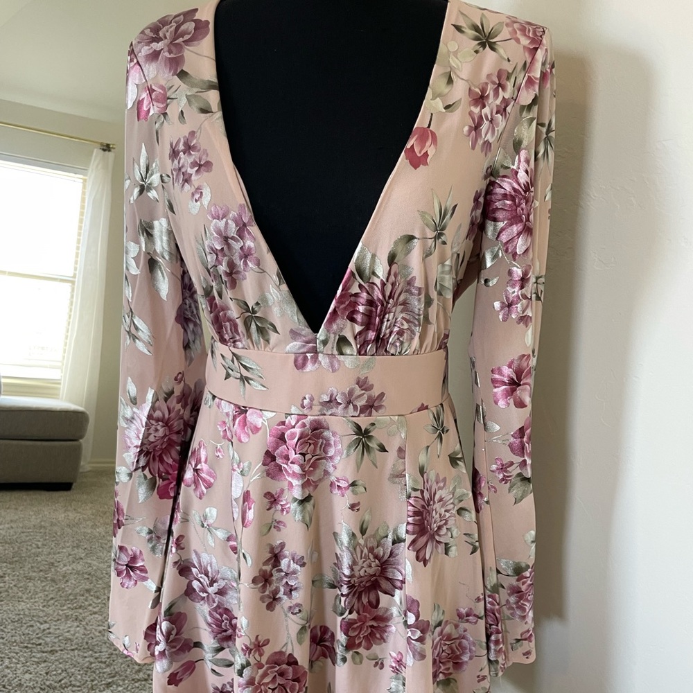 NWT floral dress with deep v cut neckline & open back.